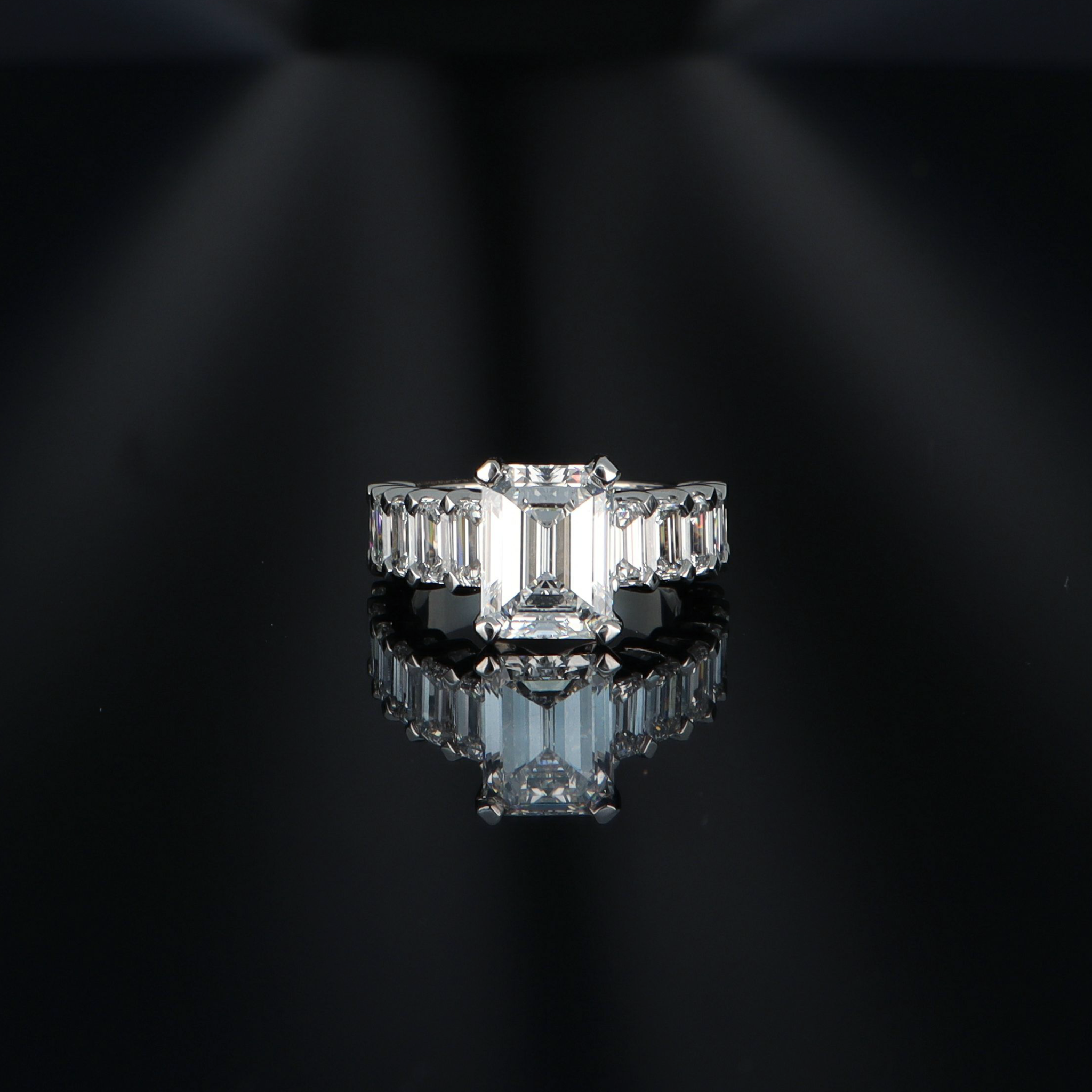 White gold ring with an emerald-cut diamond