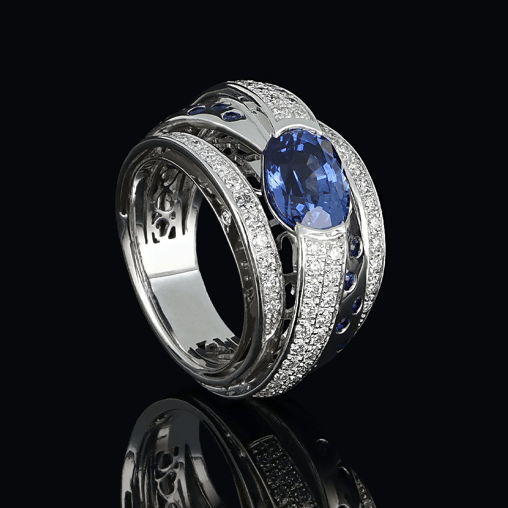 Bague arceaux en or blanc, diamants blancs et saphir bleu